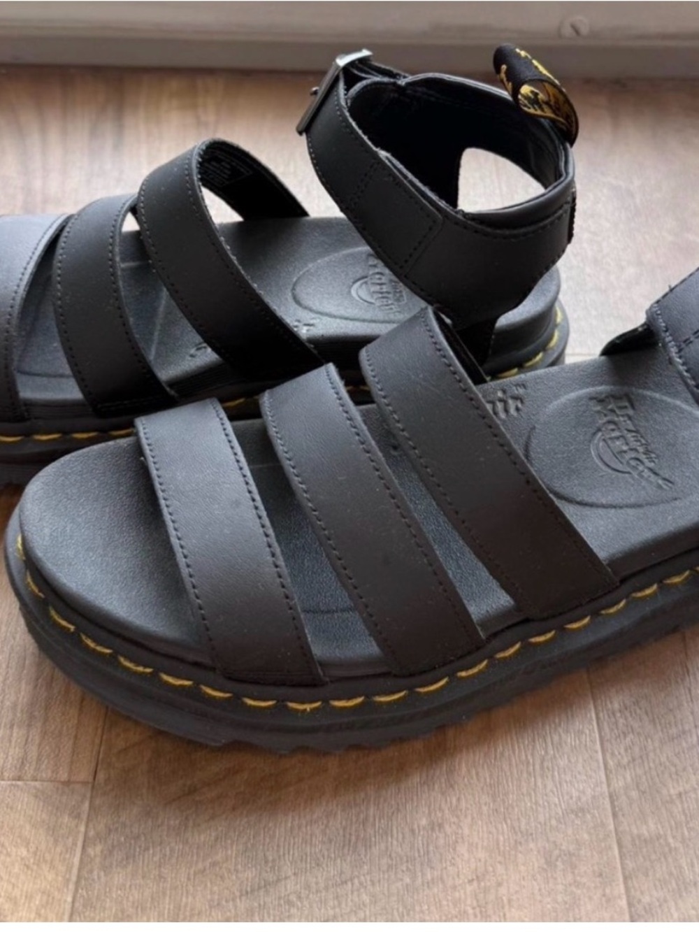 Dr. Martens Black Leather Triple-Strap Sandals with Yellow Stitching